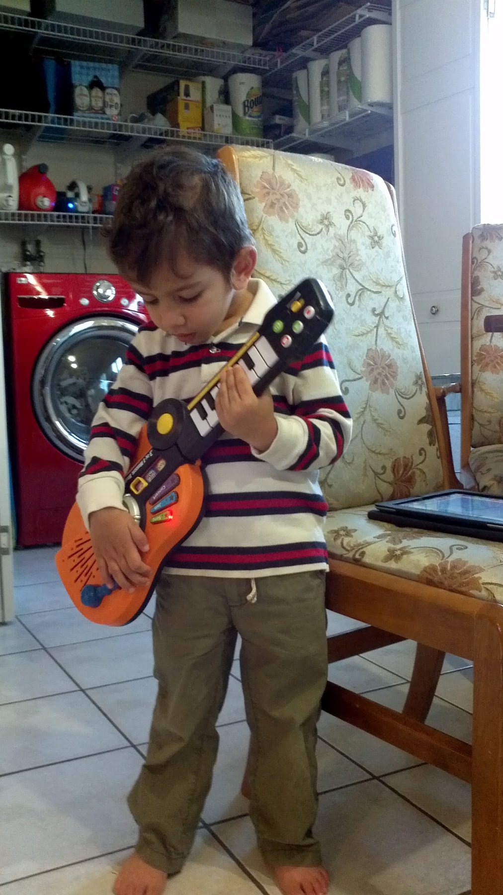 Me as a little kid playing a toy guitar