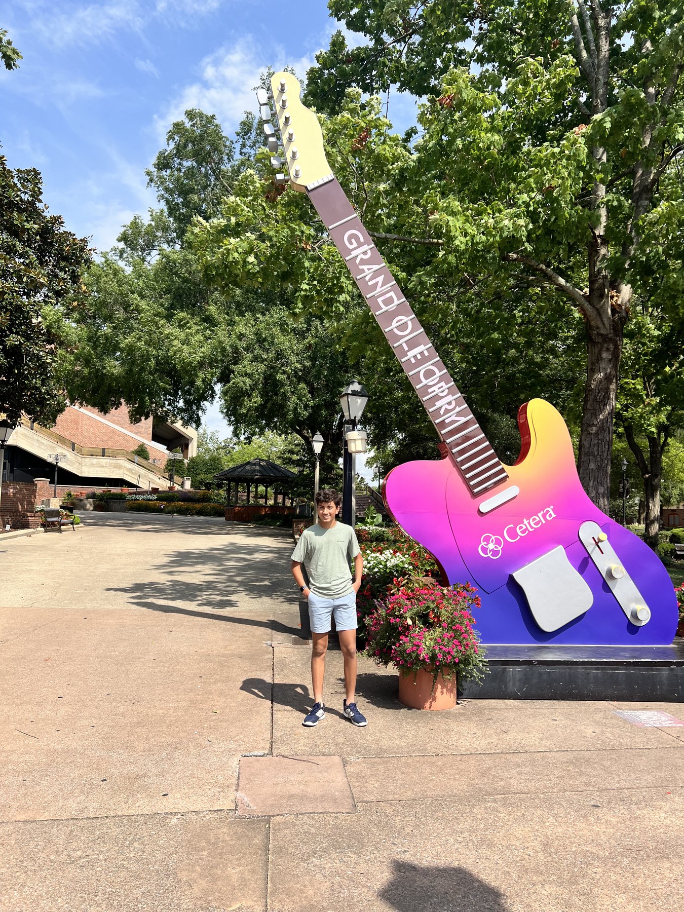 Me next to the giant guitar at the Grand Ole Opry in Nashville