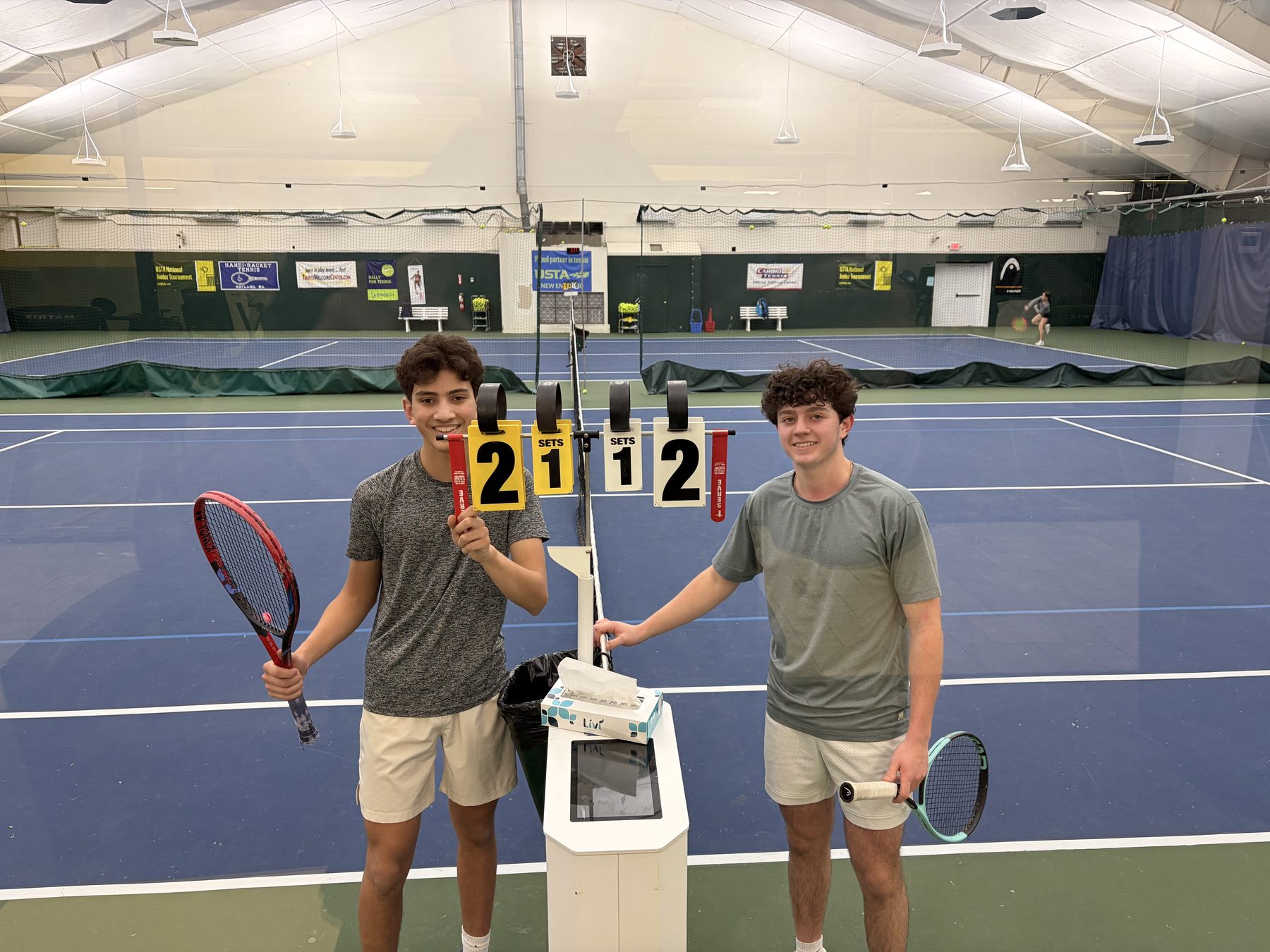 Playing a match, holding a scoreboard